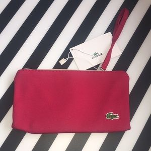 Lacoste Raspberry clutch purse. Zippered. NWT.
